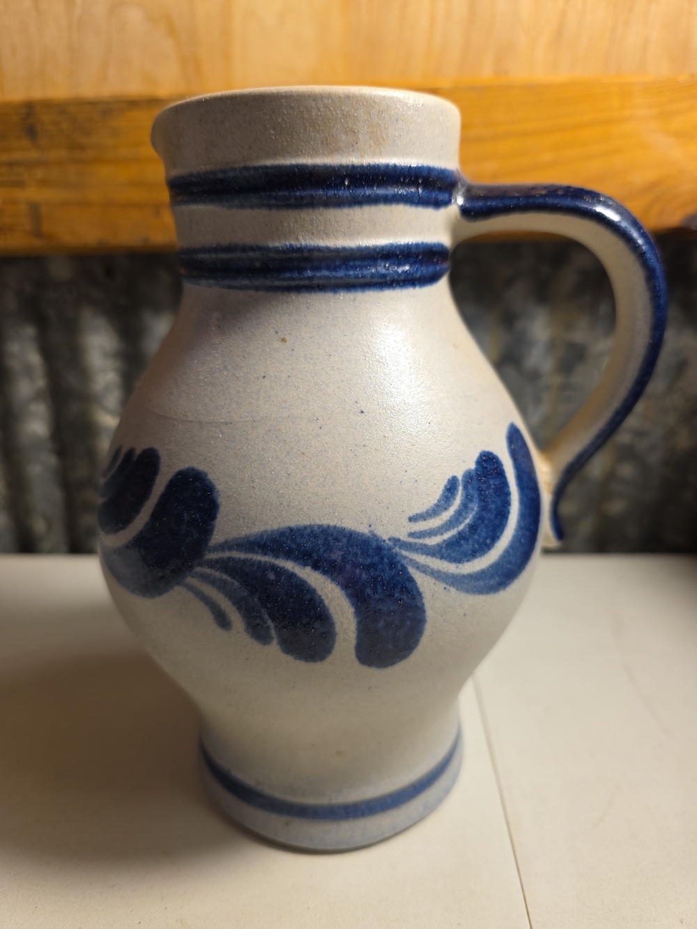 Blue and Cream Stoneware Pitcher with Hand-Painted Accent